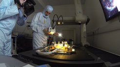 Examining the optical bench for contamination.